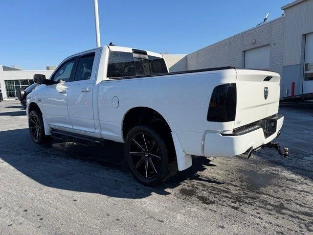 2014 RAM 1500 4WD Quad Cab 6.4 Ft Box Sport